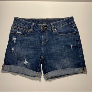 Jean shorts.  Mid waist. Distressed.